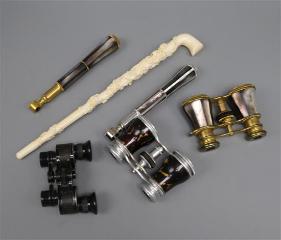 A pair of tortoiseshell opera glasses, two other pairs and a Victorian carved ivory parasol handle